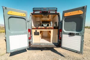 Rear doors open on the Ram Promaster showing the bed box storage