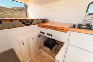 Open galley cabinet showing the electrical components