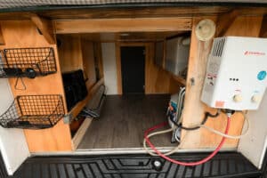 Storage under the bed platform with hot water heater and wire baskets