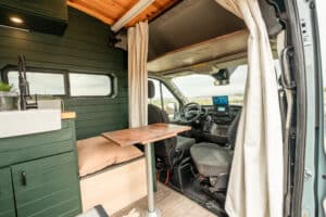 Galley counter and farm sink beside the cab and swivel seat