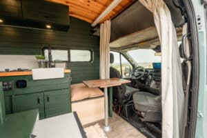 Galley with farm sink and table next to the passenger swivel seat