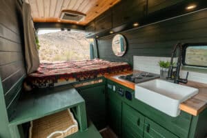 Galley with farm sink and storage next to the bed