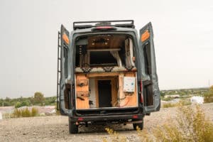 Rear doors open on the Ford Transit showing the bed platform box