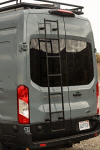 Rear of the Ford Transit camper van with Tommy Camper Vans rear ladder