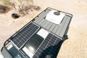 Roof of the Sprinter with solar panels on the Tommy Camper roof rack and decking