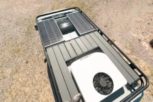 Roof rack with decking panels, solar panels and roof A/C unit